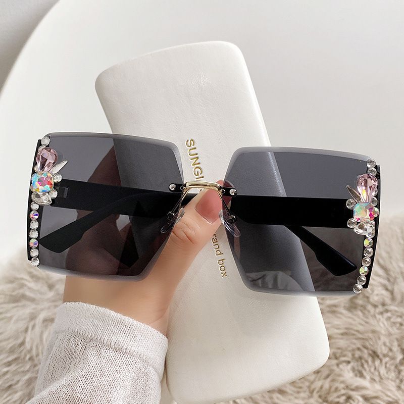 Crystal jewelled sunglasses in Black with silver side detail