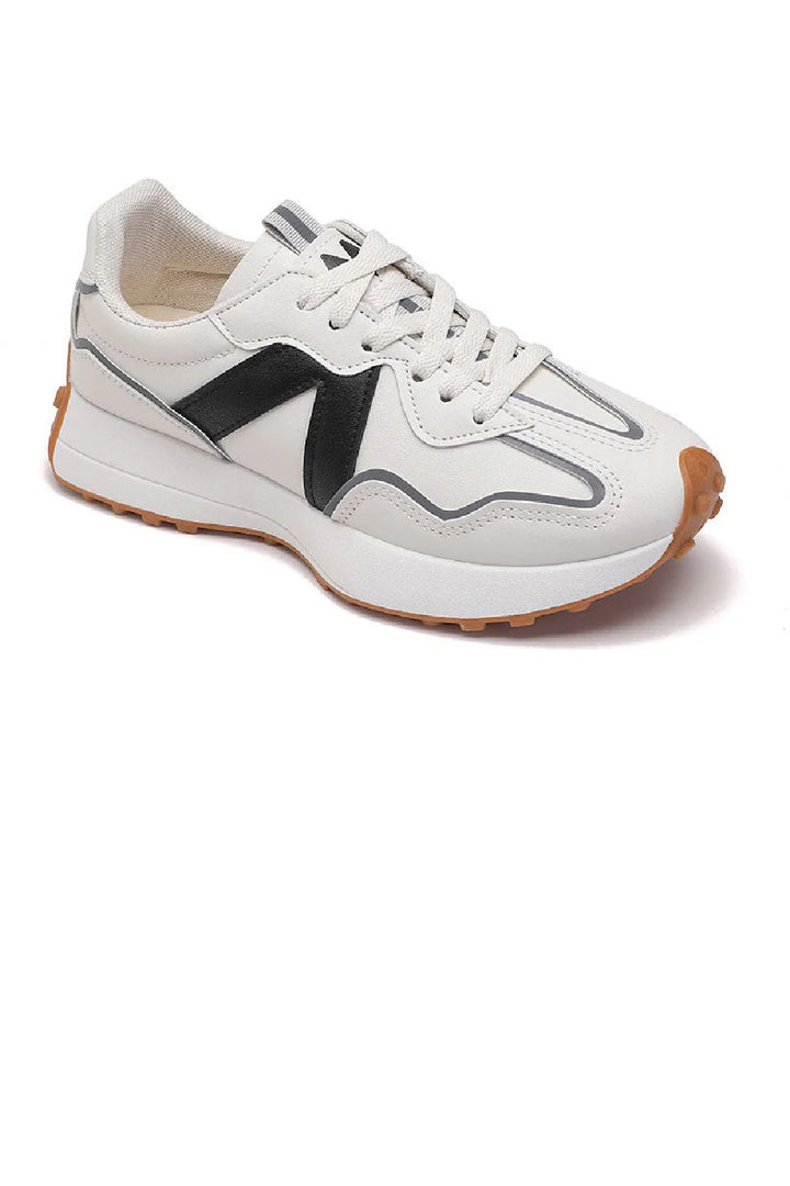 black and beige trainers