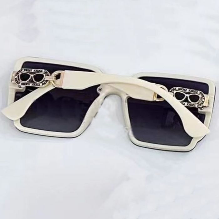 Cream ladies sunglasses with embellished side detail